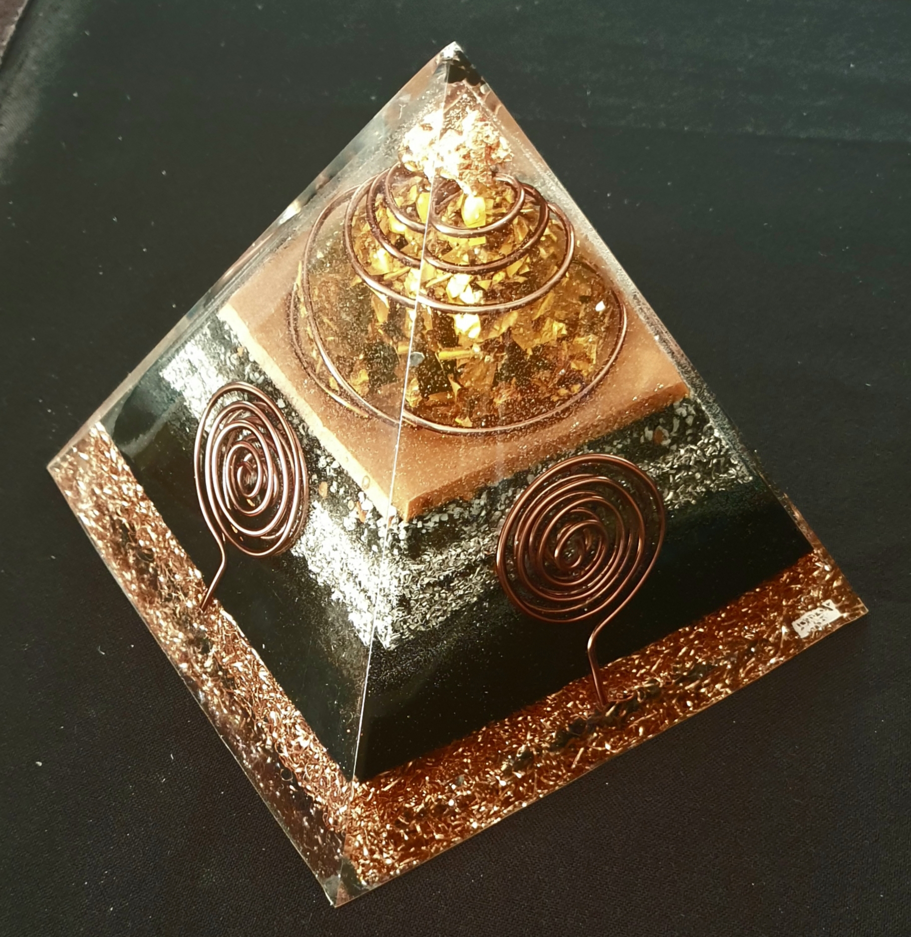 Copper and Earth series orgonite pyramid with golden copper shavings and hand-wound spiral