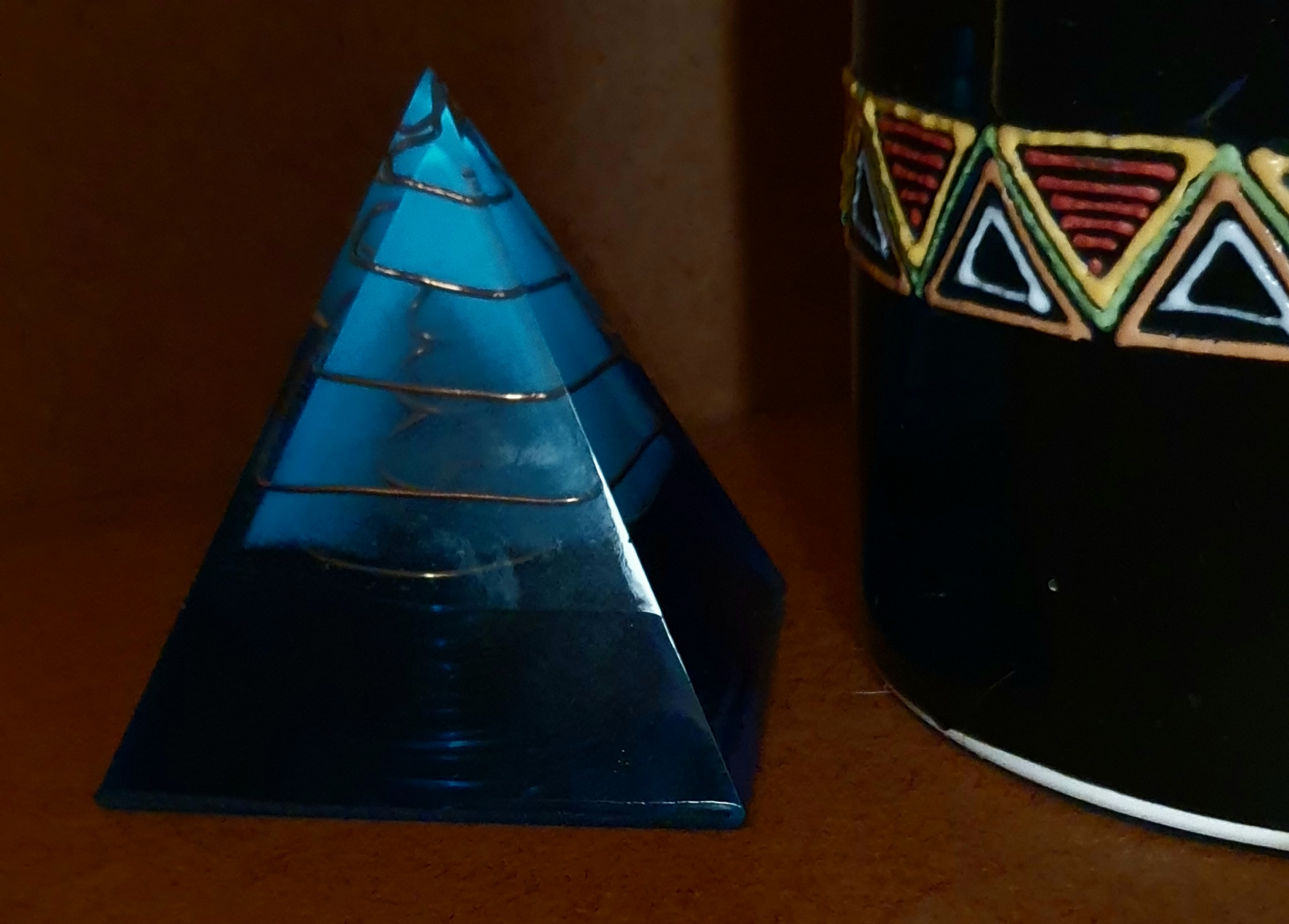 Minimalist deep blue orgonite pyramid with copper wire