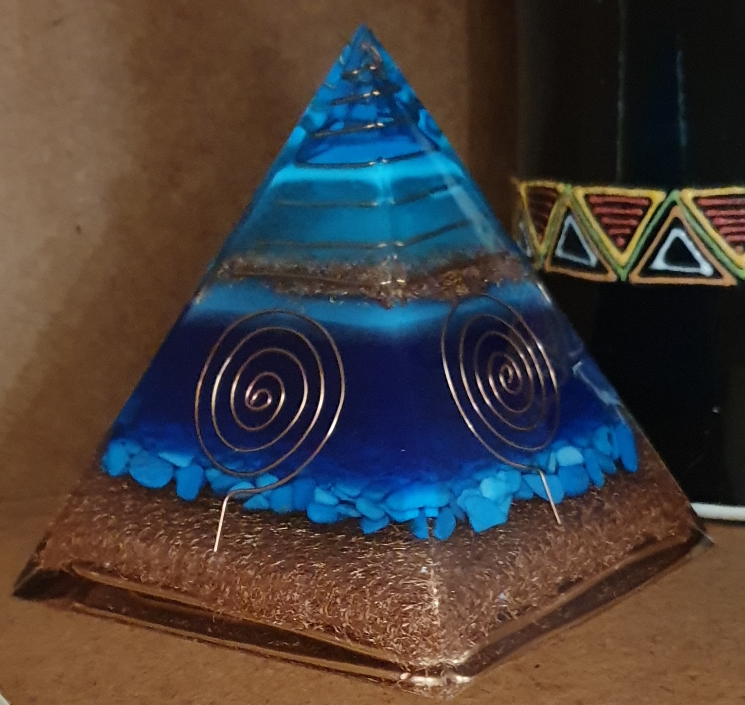 Ocean and Turquoise series orgonite pyramid with blue resin, turquoise stones, and copper spirals